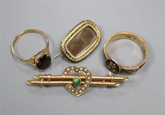 A Regency mourning brooch, a Victorian 9ct gold mourning ring, garnet ring and 15ct bar brooch.